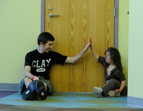 Child and volunteer at Afternoon Away. (photo by Mark Lavin)